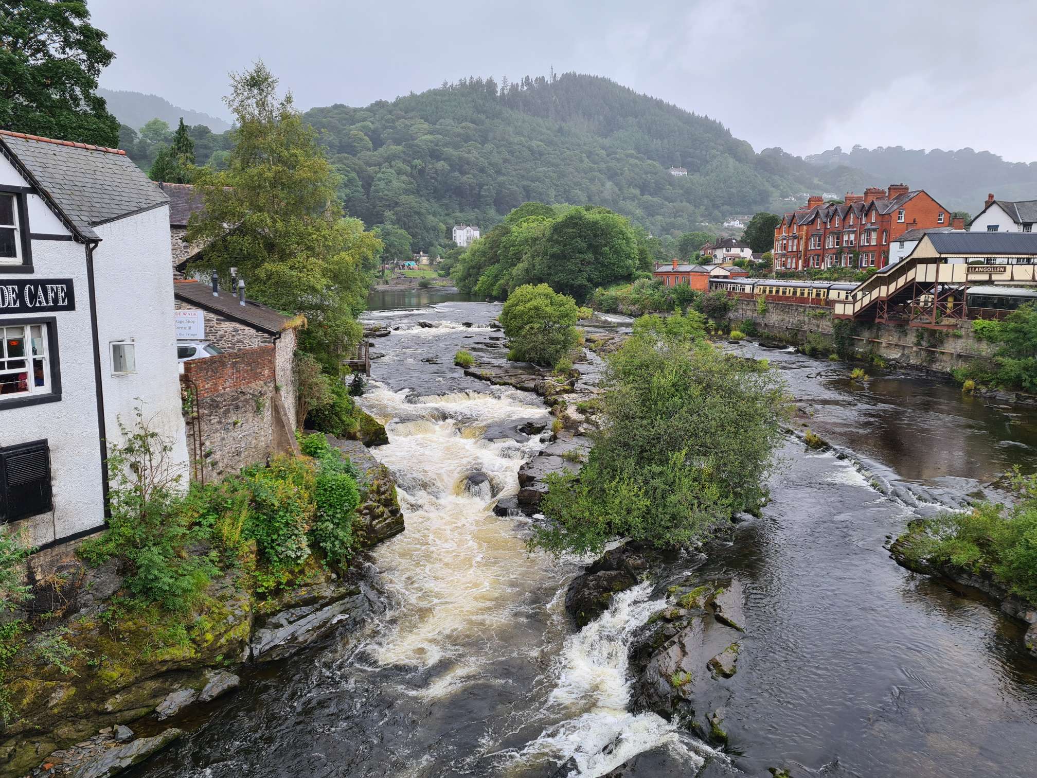 Turbulent waters of a fast flowing River Dee passing through Llangollen